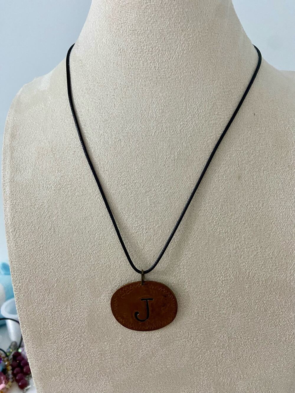Copper tone J pendant necklace